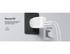 A dual USB-C wall charger in white connected to a power outlet, featuring a solid design for secure fit.