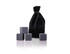 A black velvet bag with six grey gin stones arranged in front. The bag features a drawstring closure.