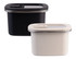 Rectangular stainless steel containers in black and cream, featuring transparent lids and a sleek design.