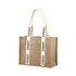 A jute tote bag in natural brown with cream-coloured handles featuring printed text and a snap closure.