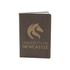 A dark grey eco notebook with a textured cover and a logo on the front. It features gold lettering and branding.