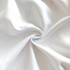 A close-up view of soft, white fleece fabric with a smooth texture.