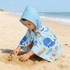A kids' hooded towel in light blue featuring playful ocean-themed prints, perfect for beach or bath use.