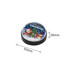 A snow globe fridge magnet featuring Santa, a reindeer, and a snowman against a festive background. Predominantly black and colourful.