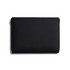 A black laptop sleeve with a smooth, minimalist design and a subtle logo. Suitable for 16-inch laptops.