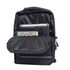 A black backpack featuring a main compartment and front pocket, with visible items like a tablet and a notebook.