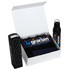A white magnetic gift box containing a drink bottle, a black box, and items wrapped in shredded paper.