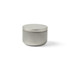 A silver mini tin candle with a lid, featuring a smooth metallic finish and a round shape.