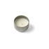 A silver tin candle with a white wax interior and a single wick, resting on a white background.