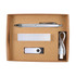 A cardboard gift set containing a silver pen, USB drive, power bank, and charging cable.