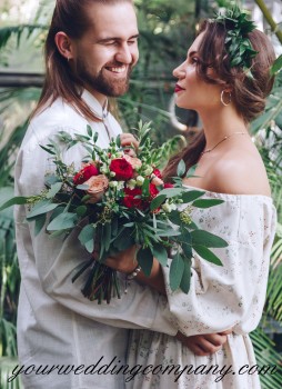 Bride & Groom Holding a Greenery Bouquet