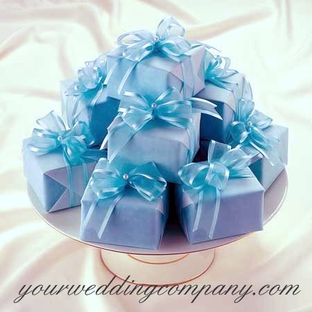 Stacked Blue Wrapped Favor Boxes With Blue Ribbon and Pearl Accents