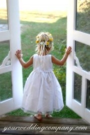 Flower girl in a white dress.