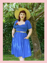 Royal Blue 1950s vintage inspired full circle Vera dress by Cerys' Closet. Made in the UK. Dress can be worn with or without the petticoat. Has a 4 panel full circle skirt with seam pockets, a sweetheart neckline and sleeves.

Ideal as bridesmaids dress, wedding guest dress, everyday dress. Worn by @miss_amy_may