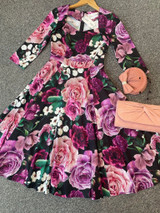 Vintage 1950s Inspired Purple, Pink and Black Floral Swing Dress with 3/4 Sleeves and Sweetheart Neckline by Cerys' Closet. A mixture of beautiful purple, burgundy, light purple, pink and white flowers with green foliage. Available in sizes 8 to 26