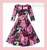 Vintage 1950s Inspired Purple, Pink and Black Floral Swing Dress with 3/4 Sleeves and Sweetheart Neckline by Cerys' Closet. A mixture of beautiful purple, burgundy, light purple, pink and white flowers with green foliage. Available in sizes 8 to 26