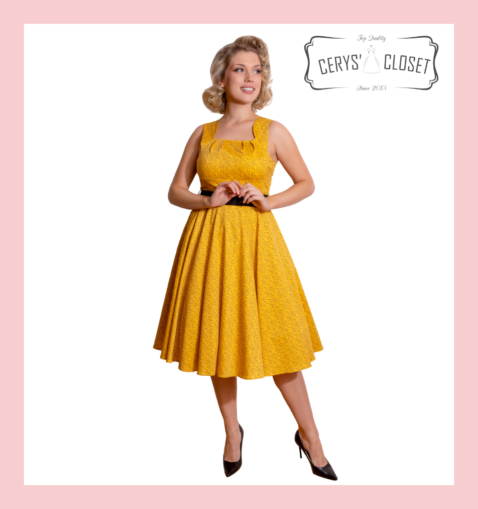 yellow top with black polka dots