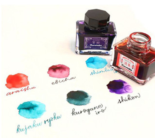 Two ink bottles and five six swatches of ink