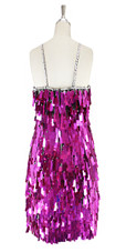 A short handmade sequin dress, in rectangular metallic fuchsia paillette sequins with silver faceted beads in back view