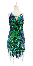 Short handmade sequin dress, in iridescent green paillette sequins with silver faceted beads, a luxe grey fabric background and jagged, beaded hemline front view