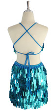 A short handmade sequin dress, in rectangular metallic turquoise color sequins back view