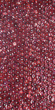 A short handmade sequin dress, in 8mm cupped red metallic red sequins with silver faceted beads close up view