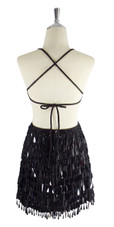 A short handmade sequin dress, with tear-drop shaped black paillette sequins back view