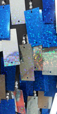 A long handmade sequin dress, in rectangular silver and hologram blue paillette sequins close up view