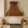 Traditional kitchen featuring a wall-mount custom design copper range hood with zinc accents