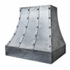 Handcrafted wrought iron range hood with riveted strap design side view