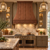 Designer copper range hood with gothic apron installed in an elegant luxury kitchen