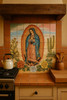 Mexican tile mural of our lady of guadalupe with cactus landscape in a rustic kitchen.