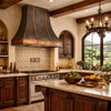 Mixed-metal zinc and copper range hood in a kitchen with historic Spanish ironwork and Mediterranean metal accents