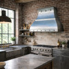 Industrial kitchen furnished with a wall mount custom architectural zinc range hood with riveted detail and flared canopy