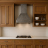 Handmade raw natural iron 42-inch range hood with tapered bell silhouette in a traditional style kitchen