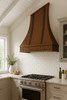 Copper range hood for a cathedral kitchen with a vaulted ceiling