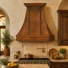 36-inch copper range hood in a mediterranean kitchen with warm textured finishes