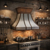Iron range hood with riveted straps and flared collar in a industrial style loft kitchen