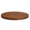 Handcrafted round copper dining table top side view, visible edge thickness with hammered surface and light patina