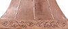 Handcrafted polished copper range hood with floral apron in French style