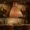 Restaurant bar furnished with a polished copper vent hood