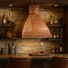 Restaurant with polished copper range hood and Rococo apron design, reflective canopy above range with balanced cabinetry