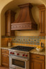 Southeaster style kitchen with a swall mount olid copper range hood 