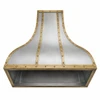 Antique zinc range hood with brass straps and rivets, underside view showing the hollow opening for a vent insert