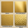 Finish and texture swatches for hammered brass range hood with riveted straps, showing natural or polished options