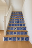 Staircase with every riser adorned in the blue-and-white Talavera tiles