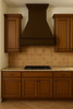 Rustic kitchen featuring 48 inch custom copper vent hood
