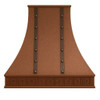 Hand‑hammered copper kitchen hood with Spanish Revival style