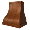 Sweeping design copper range hood shown at an angle