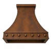Round-hammered trapezoid copper range hood underside with rectangular opening for ventilation insert